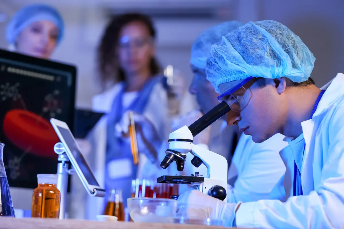 Scientists working with samples in laboratory