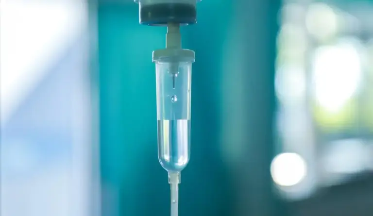Set iv fluid intravenous drop saline drip hospital room,Medical Concept,treatment emergency and injection drug infusion care chemotherapy, concept.blue light background,selective focus stock photo