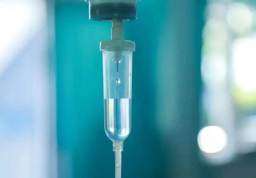 Set iv fluid intravenous drop saline drip hospital room,Medical Concept,treatment emergency and injection drug infusion care chemotherapy, concept.blue light background,selective focus stock photo